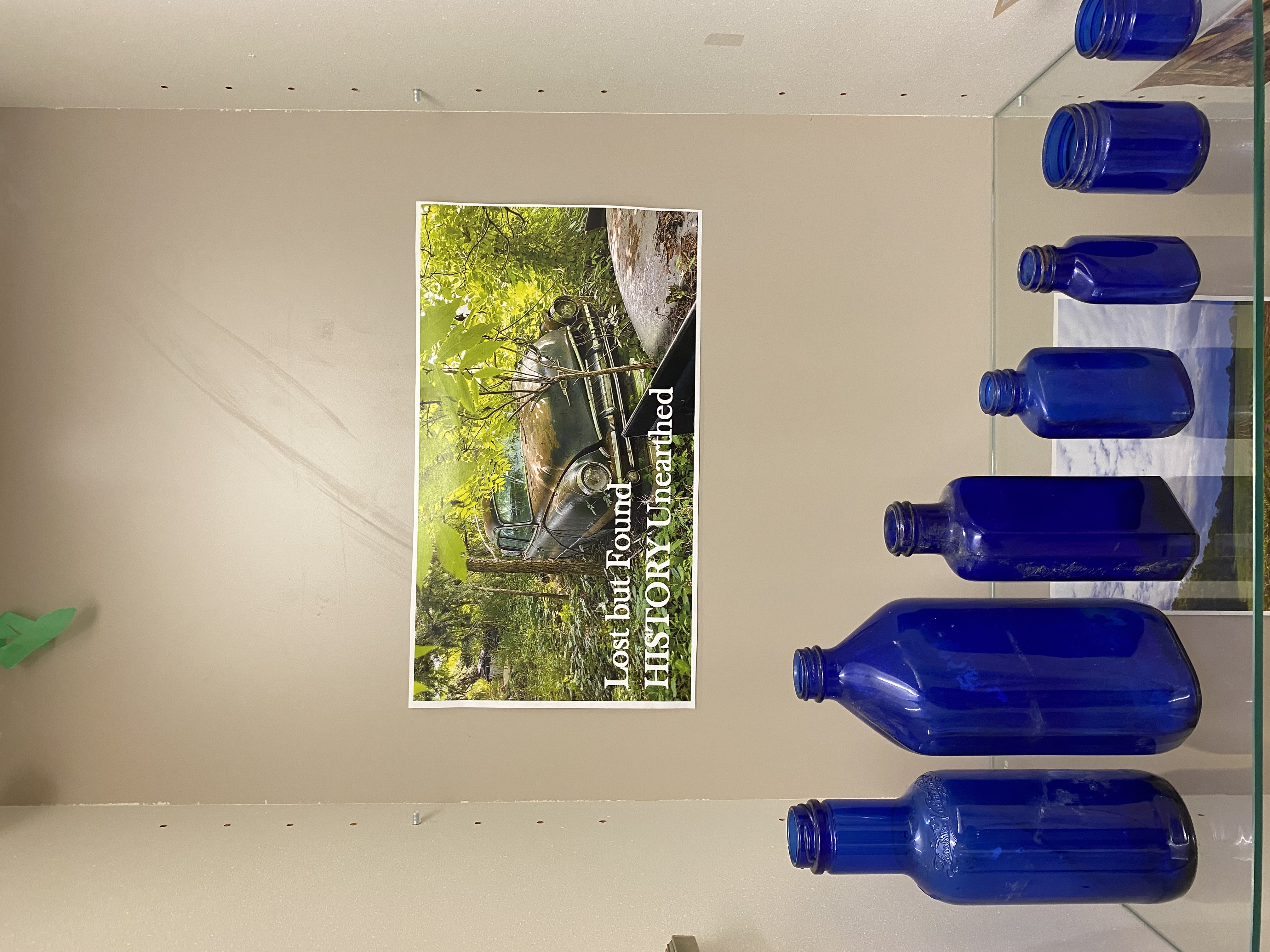 Blue Bottles Made of Glass Lined Up