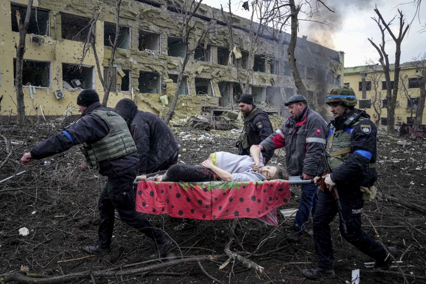 Victim being carried through rubble